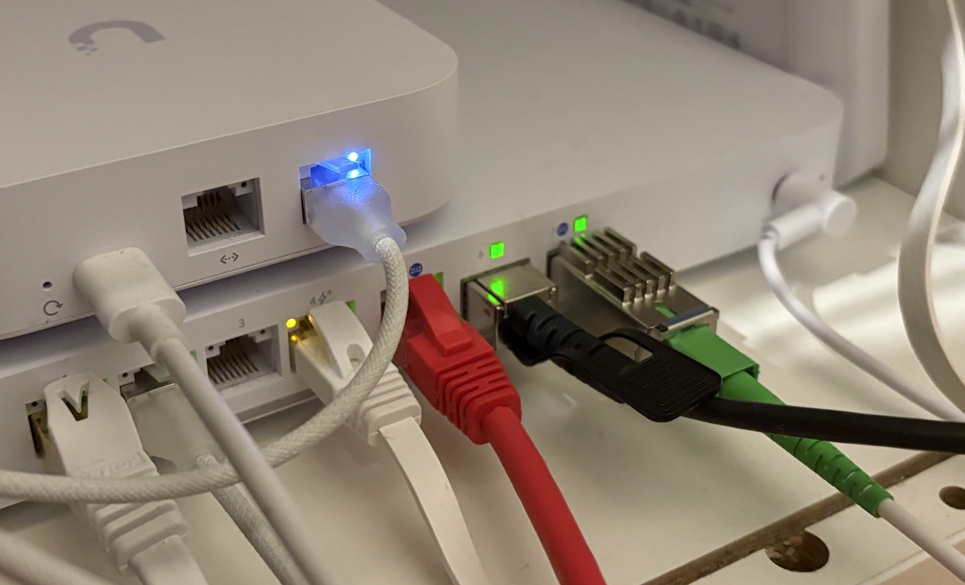 The X-ONU-SFPP module inserted to Port 7 on my Ubiquiti Cloud Gateway Fiber, with an SC/APC SM fibre optic cable connected directly from the 'fibre box' on my wall.
